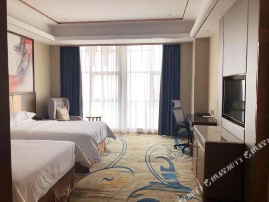 Bed in Venus Royal Hotel Nanning East High-Speed Railway Station