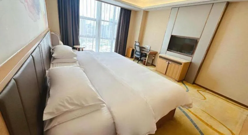 Bed in Venus Royal Hotel Nanning East High-Speed Railway Station