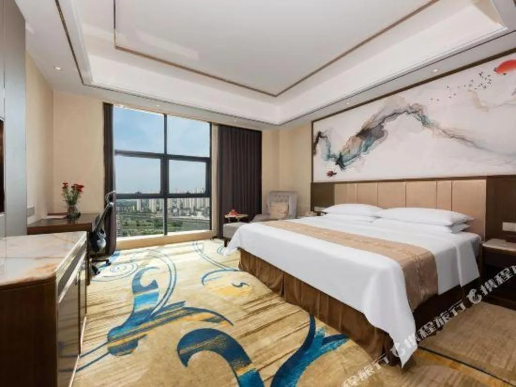 Bed in Venus Royal Hotel Nanning East High-Speed Railway Station