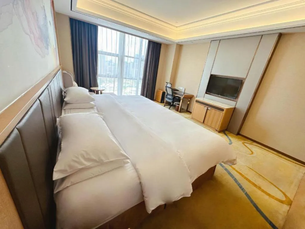 Bed in Venus Royal Hotel Nanning East High-Speed Railway Station