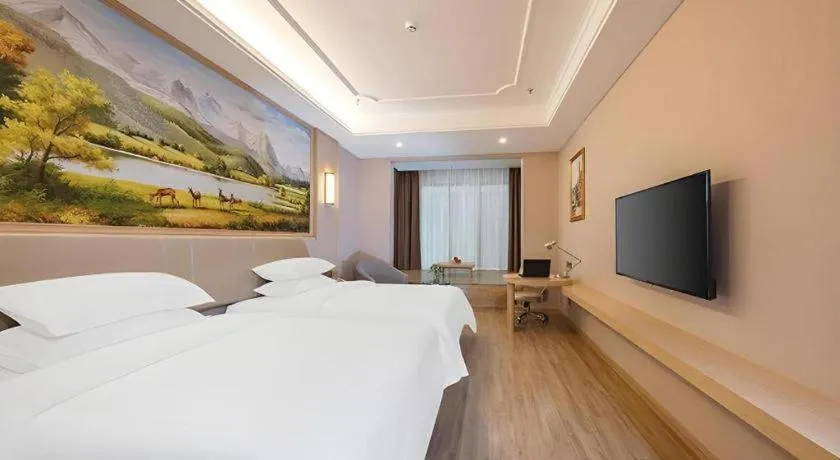Bed in Vienna Hotel Fuzhou University Town Boshihou