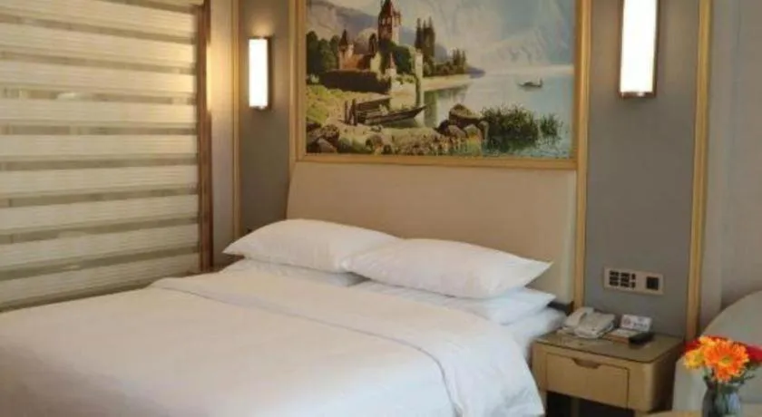 Bed in Vienna Hotel Guangdong Zhaoqing East Station Dinghu Mountain Scenic Area