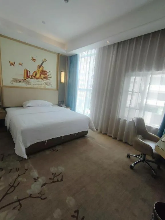 Bed in Vienna Hotel Guangdong Zhaoqing East Station Dinghu Mountain Scenic Area
