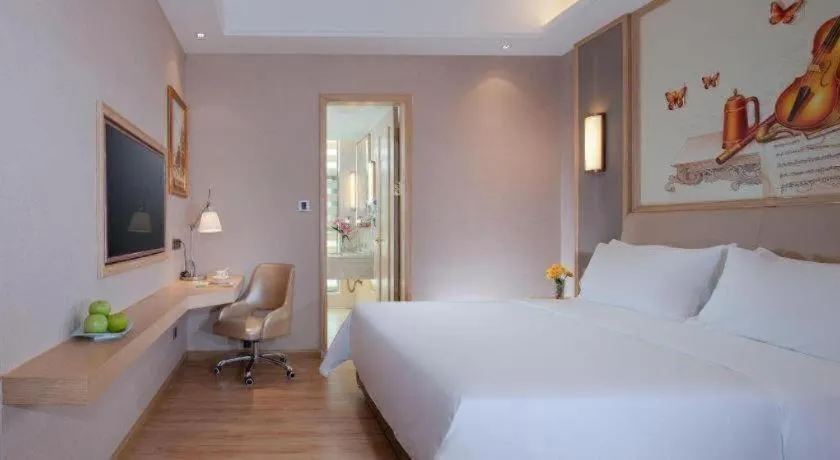 Bed in Vienna Hotel Guangdong Zhaoqing East Station Dinghu Mountain Scenic Area