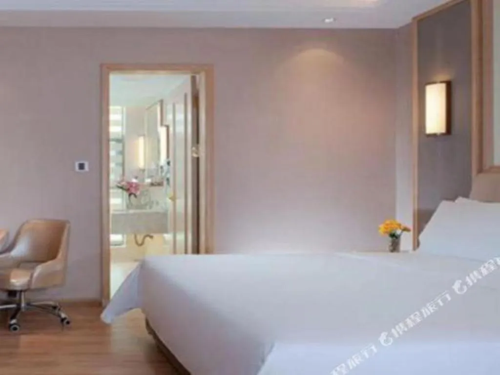 Bed in Vienna Hotel Guangdong Zhaoqing East Station Dinghu Mountain Scenic Area