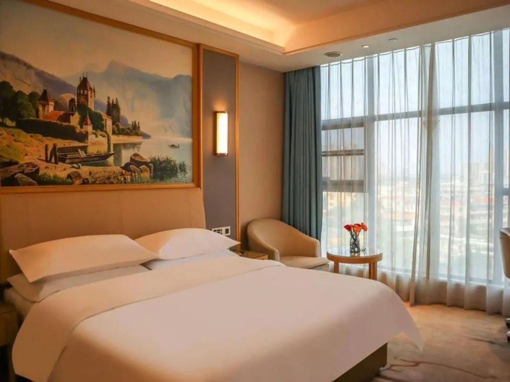 Bed in Vienna Hotel Guangdong Zhaoqing East Station Dinghu Mountain Scenic Area