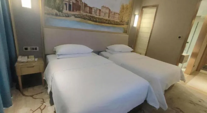 Bed in Vienna Hotel Guangdong Zhaoqing East Station Dinghu Mountain Scenic Area