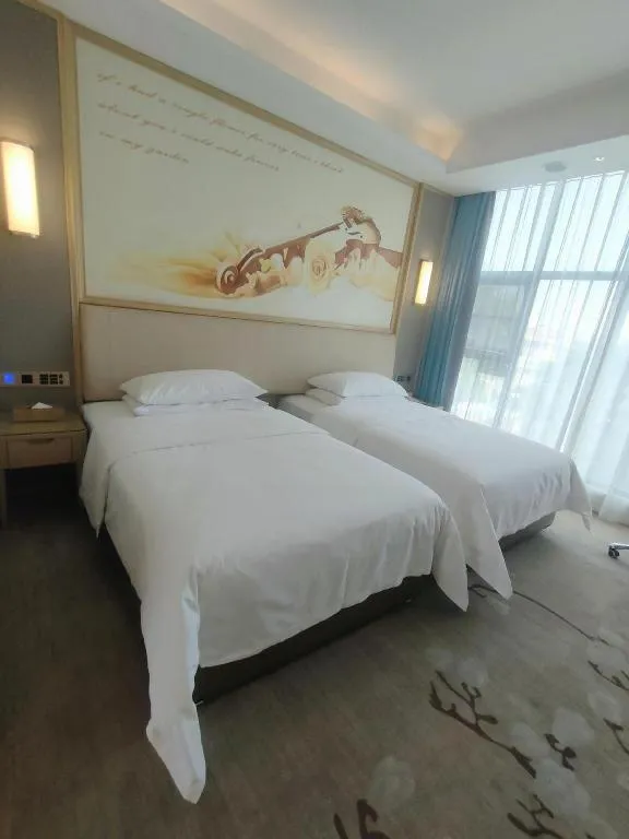 Bed in Vienna Hotel Guangdong Zhaoqing East Station Dinghu Mountain Scenic Area