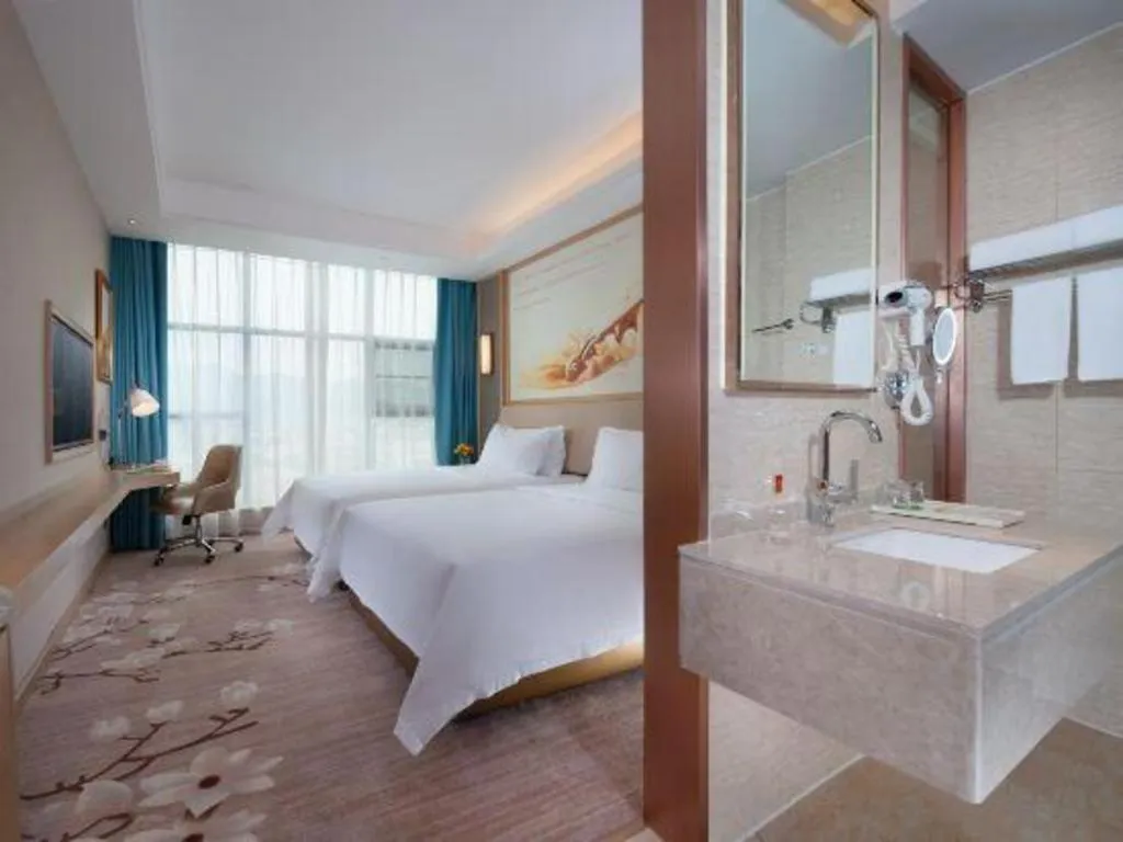 Bed in Vienna Hotel Guangdong Zhaoqing East Station Dinghu Mountain Scenic Area