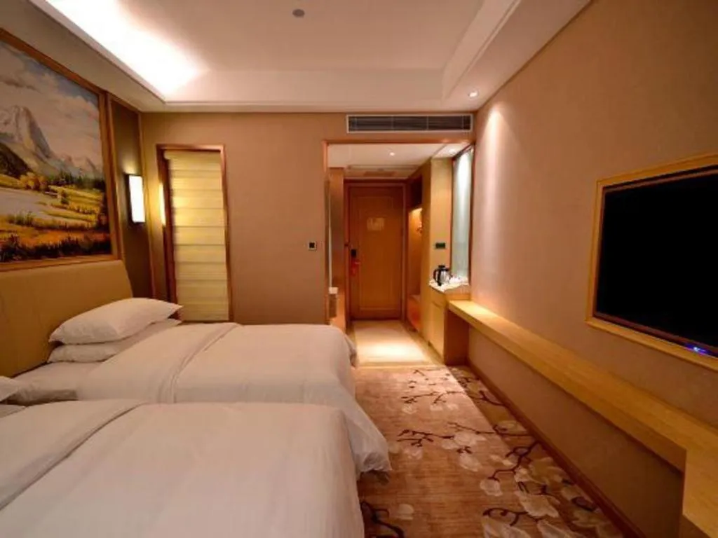 Bed in Vienna Hotel Guangdong Zhaoqing East Station Dinghu Mountain Scenic Area