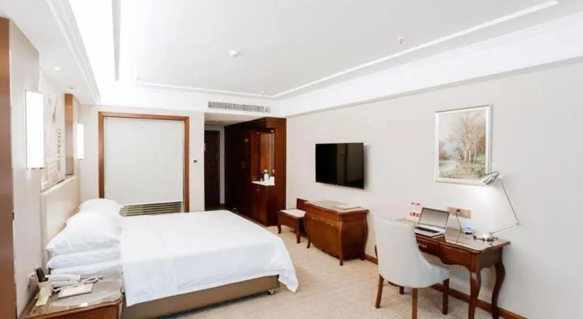 Bed in Vienna Hotel Jiangxi Fuzhou Lichuan Kangshu