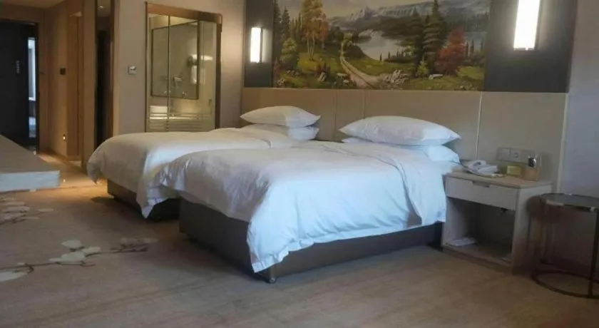 Bed in Vienna Hotel Yunnan Lijiang Ancient City