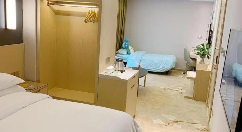 Bed in Vienna Hotel Yunnan Lijiang Ancient City