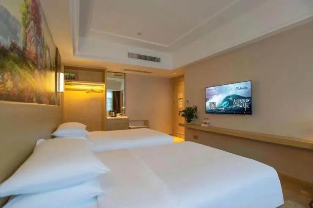 Bed in Vienna Hotel Yunnan Lijiang Ancient City