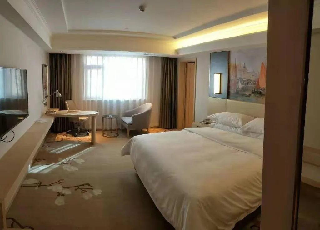 Bed in Vienna Hotel Yunnan Lijiang Ancient City