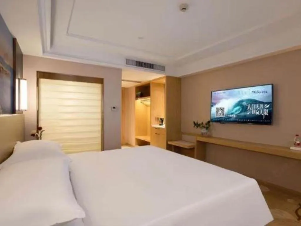 Bed in Vienna Hotel Yunnan Lijiang Ancient City