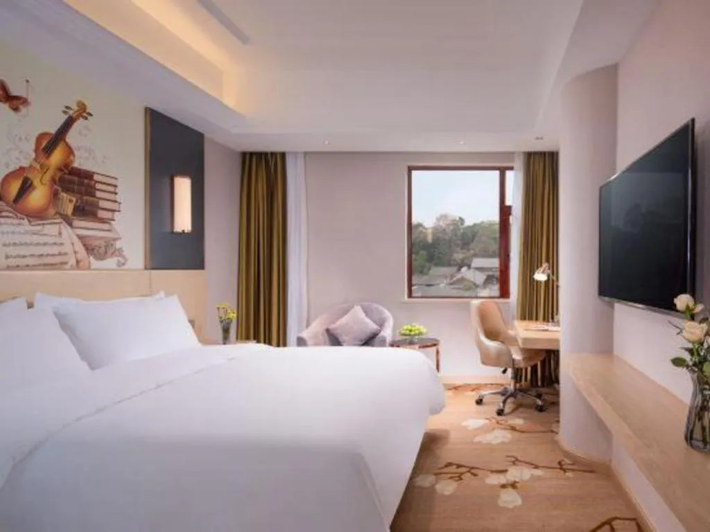 Bed in Vienna Hotel Yunnan Lijiang Ancient City