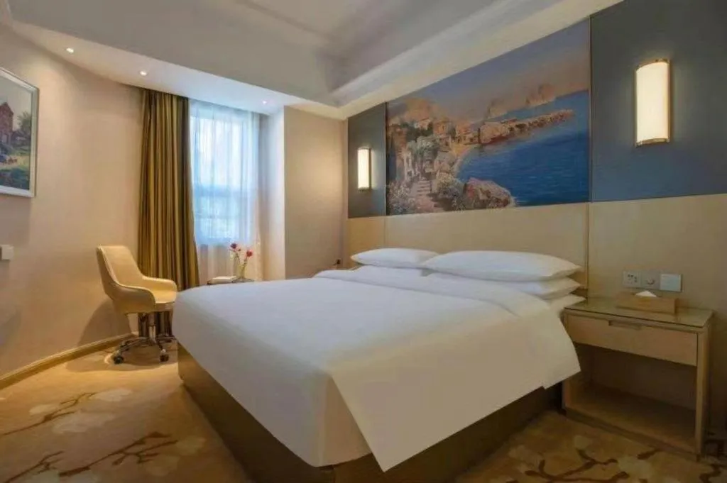 Bed in Vienna Hotel Yunnan Lijiang Ancient City