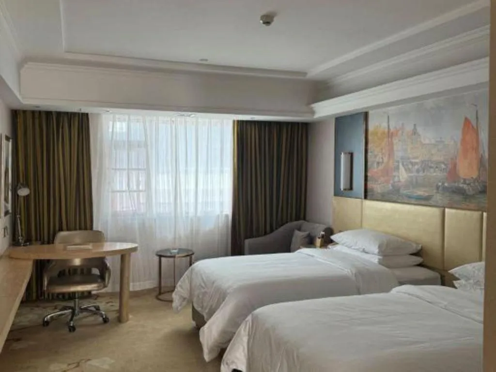 Bed in Vienna Hotel Yunnan Lijiang Ancient City