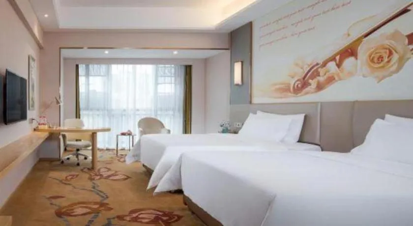 Bed in Vienna Hotel Yunnan Lijiang Ancient City