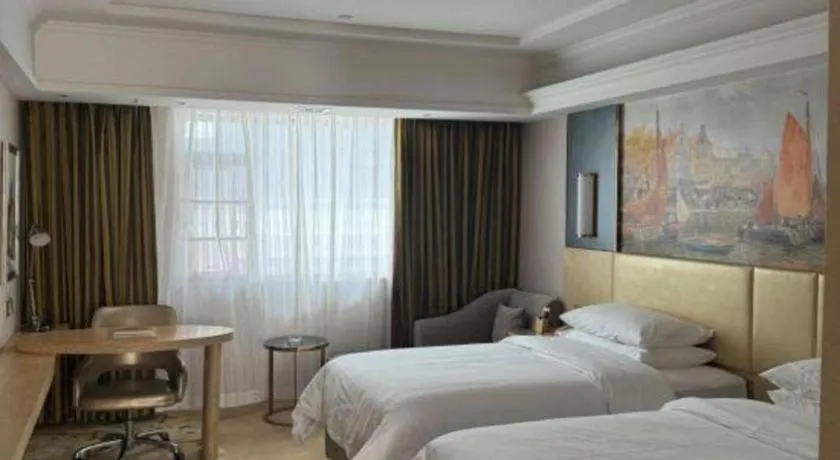 Bed in Vienna Hotel Yunnan Lijiang Ancient City