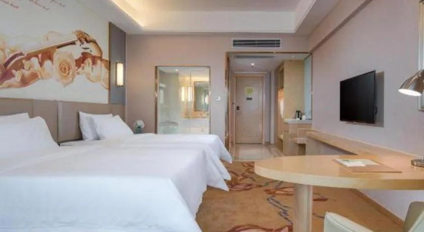 Bed in Vienna Hotel Yunnan Lijiang Ancient City