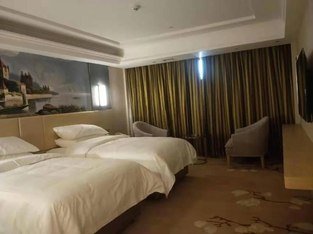 Bed in Vienna Hotel Yunnan Lijiang Ancient City