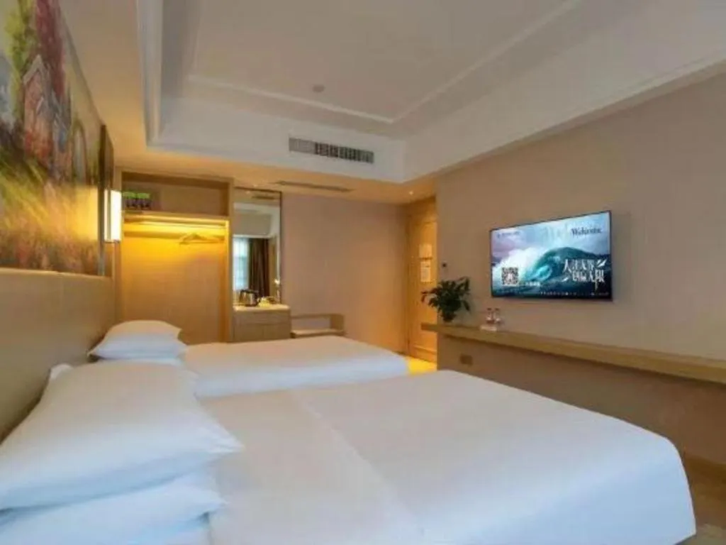 Bed in Vienna Hotel Yunnan Lijiang Ancient City