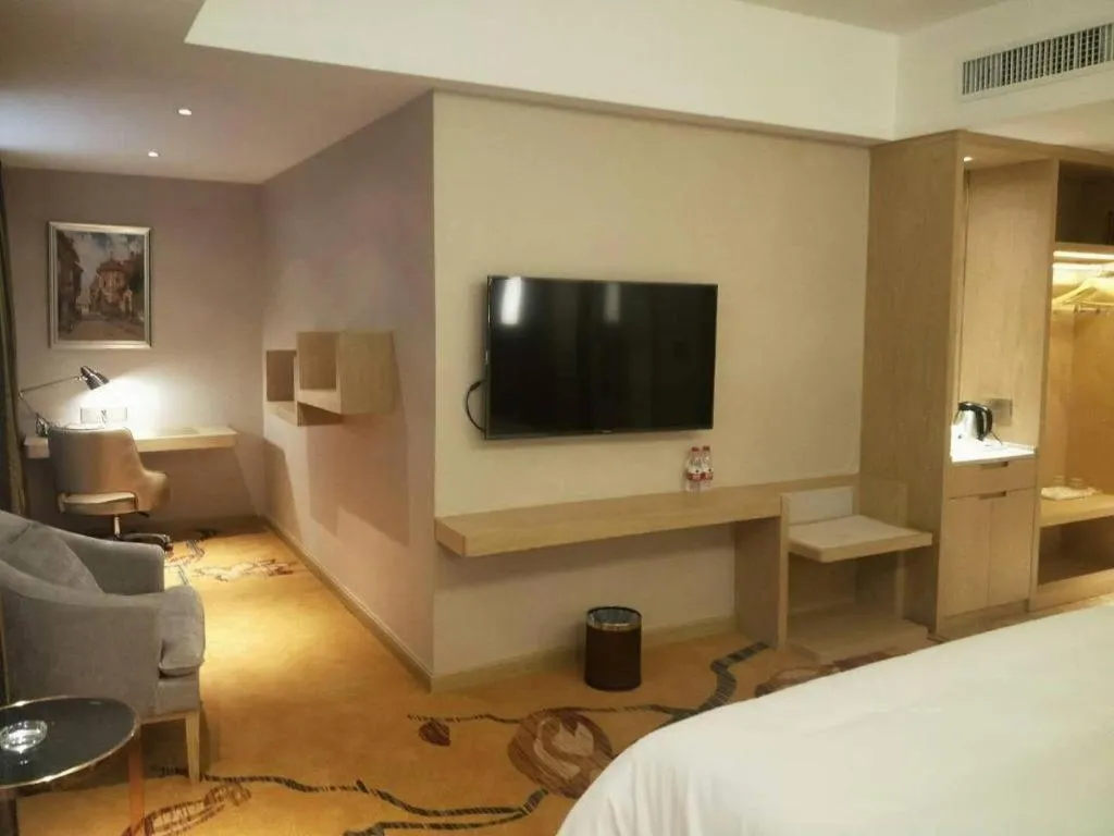 Bed in Vienna Hotel Yunnan Lijiang Ancient City