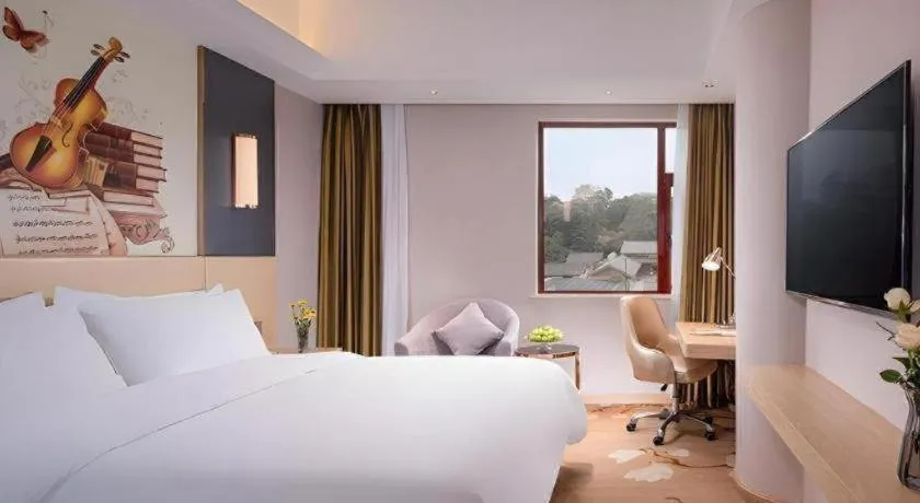 Bed in Vienna Hotel Yunnan Lijiang Ancient City