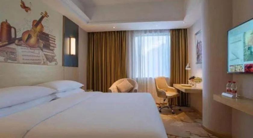 Bed in Vienna Hotel Yunnan Lijiang Ancient City