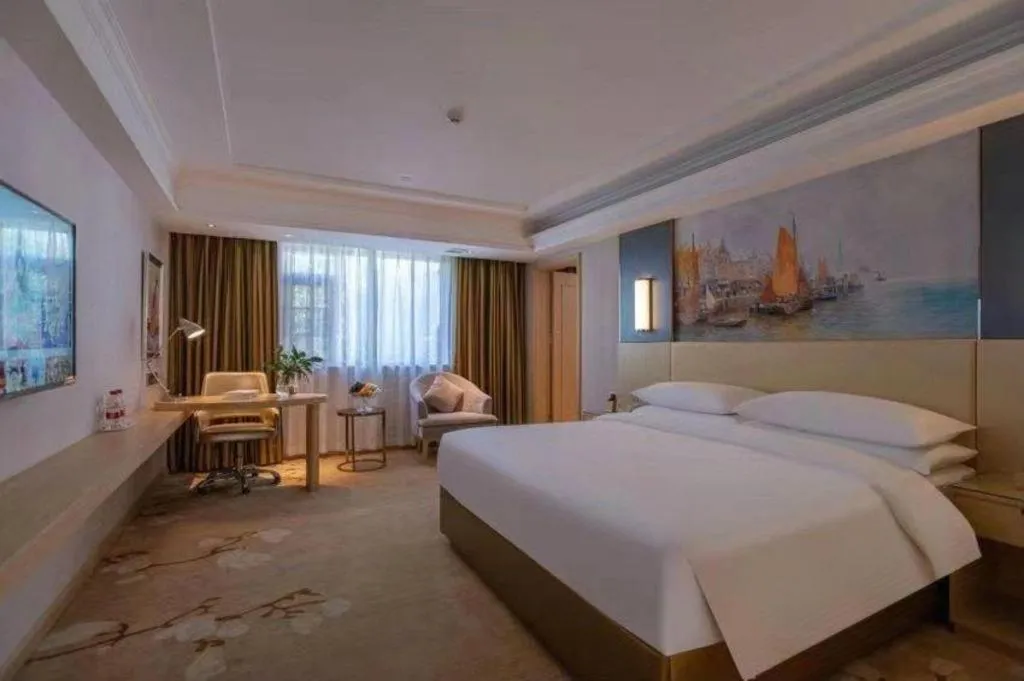 Bed in Vienna Hotel Yunnan Lijiang Ancient City