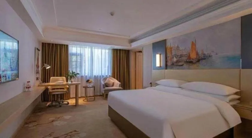 Bed in Vienna Hotel Yunnan Lijiang Ancient City