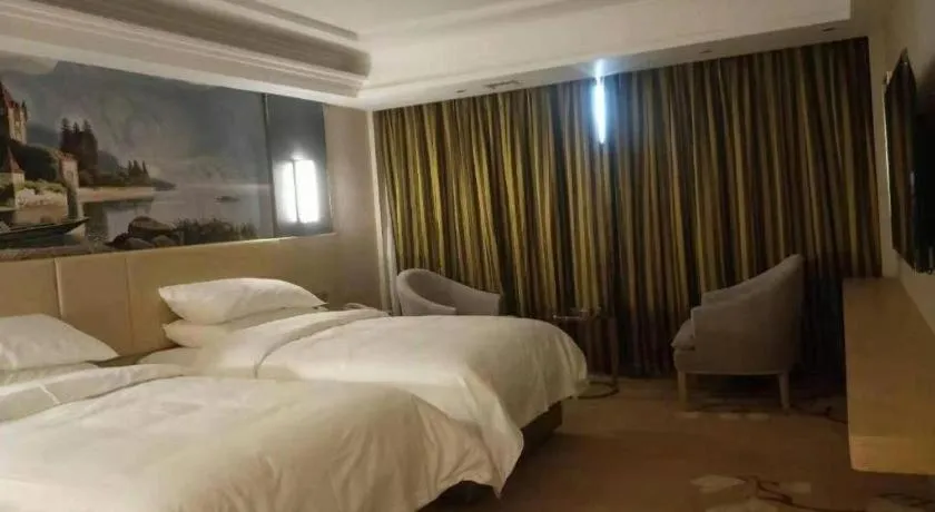 Bed in Vienna Hotel Yunnan Lijiang Ancient City