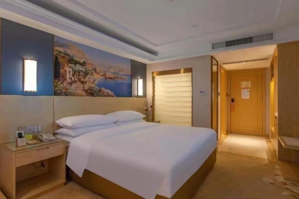 Bed in Vienna Hotel Yunnan Lijiang Ancient City