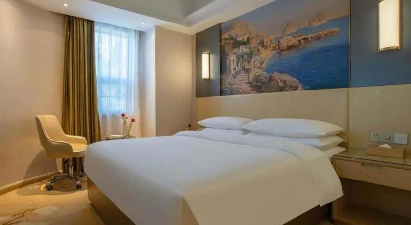 Bed in Vienna Hotel Yunnan Lijiang Ancient City