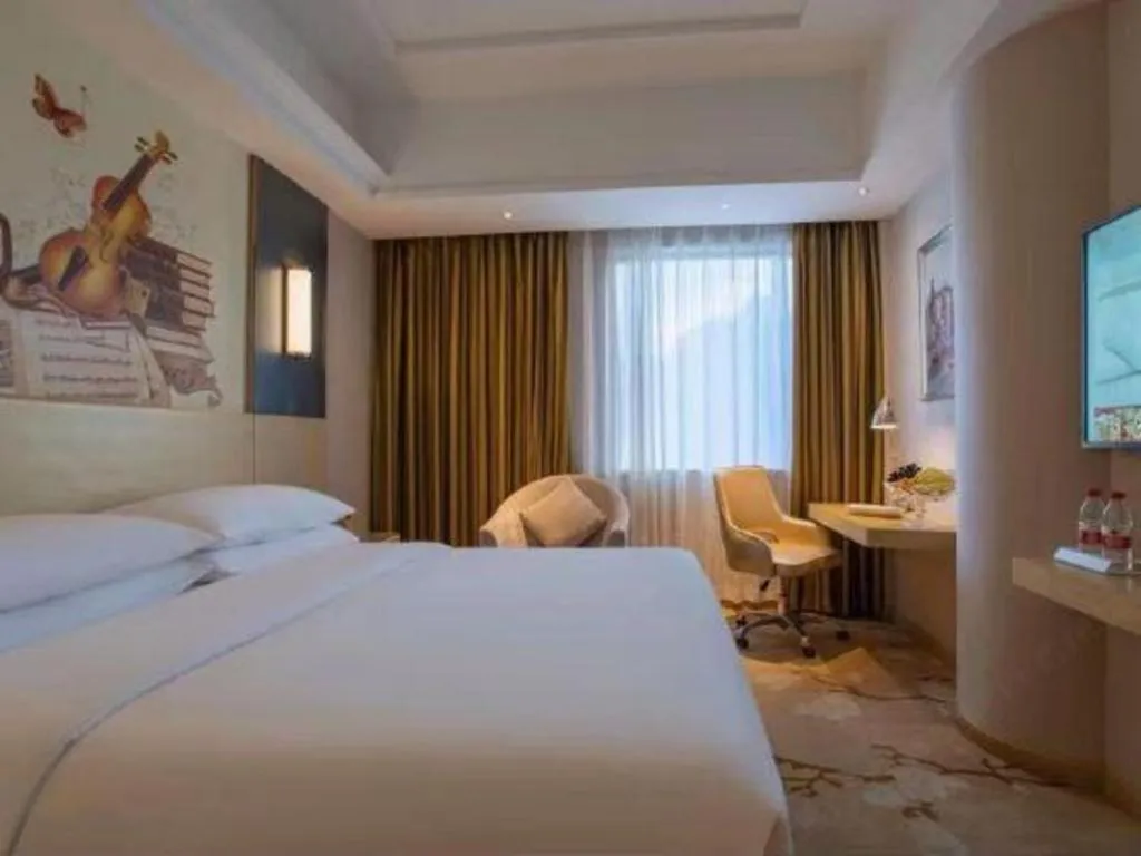 Bed in Vienna Hotel Yunnan Lijiang Ancient City