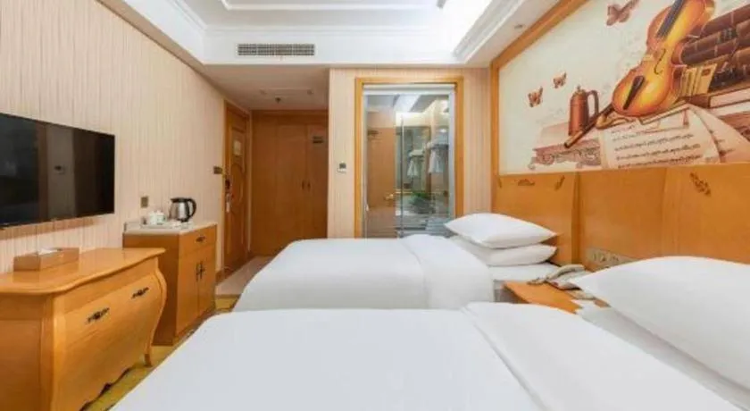 Bed in Vienna Hotel Hebei Cangzhou Mingzhu Market