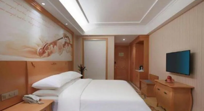 Bed in Vienna Hotel Hebei Cangzhou Mingzhu Market