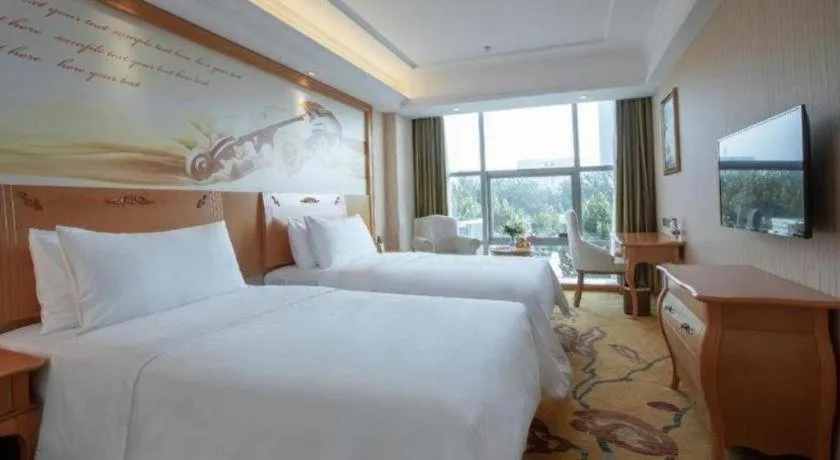 Bed in Vienna Hotel Hebei Cangzhou Mingzhu Market