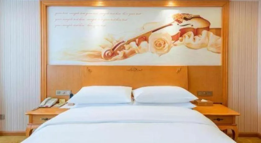 Bed in Vienna Hotel Hebei Cangzhou Mingzhu Market