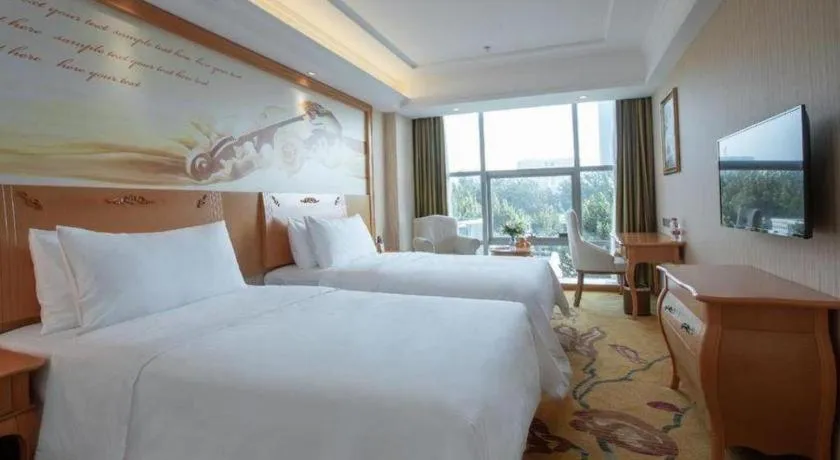 Bed in Vienna Hotel Hebei Cangzhou Mingzhu Market