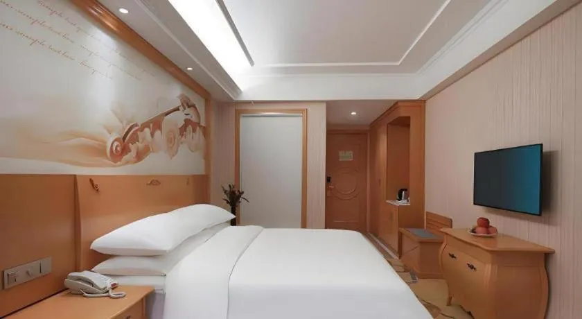 Bed in Vienna Hotel Hebei Cangzhou Mingzhu Market