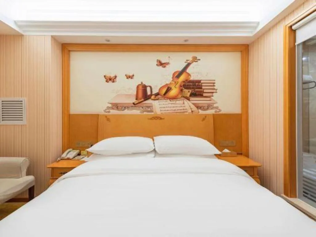 Bed in Vienna Hotel Hebei Cangzhou Mingzhu Market