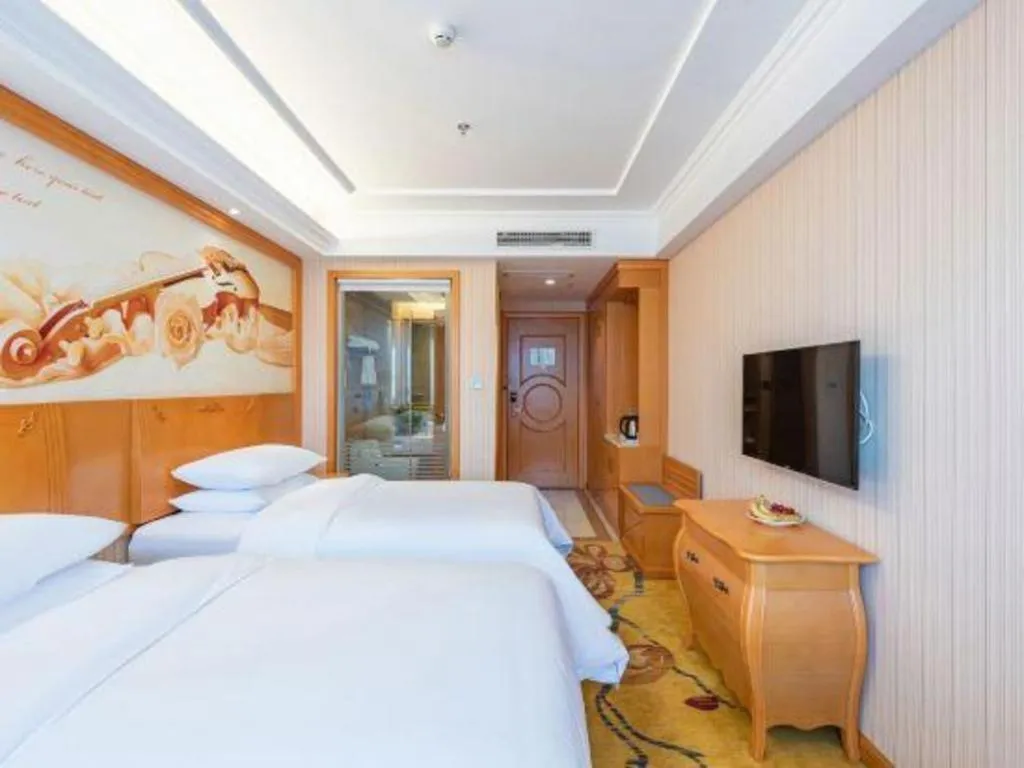 Bed in Vienna Hotel Hebei Cangzhou Mingzhu Market