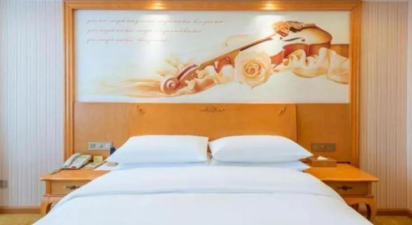 Bed in Vienna Hotel Hebei Cangzhou Mingzhu Market