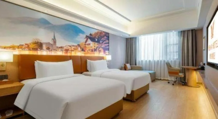 Bed in Vienna Hotel Hunan Jishou Fenghuang Ancient City