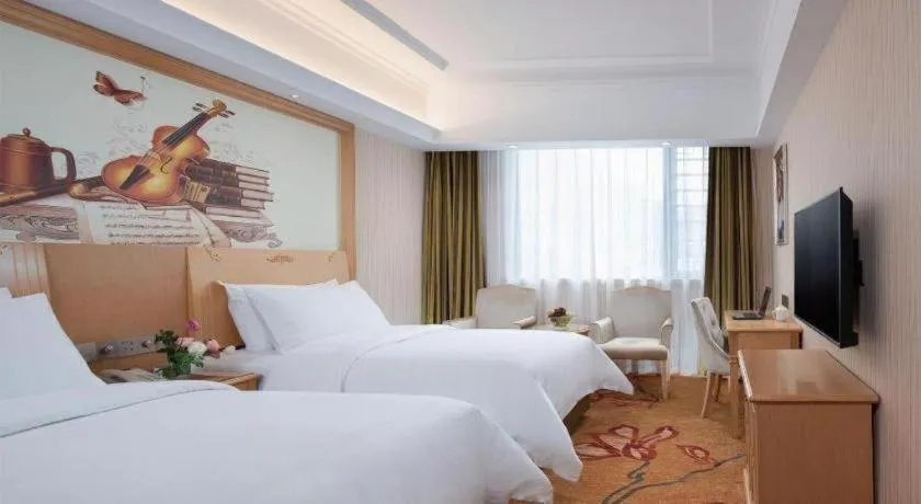 Bed in Vienna Hotel Hunan Jishou Fenghuang Ancient City