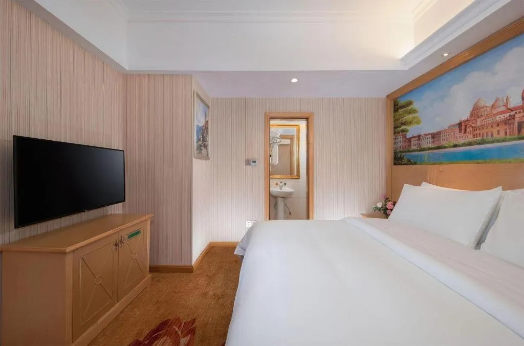 Bed in Vienna Hotel Hunan Jishou Fenghuang Ancient City