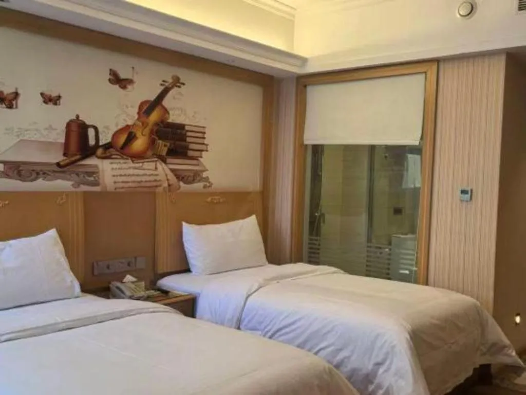 Bed in Vienna Hotel Hunan Jishou Fenghuang Ancient City